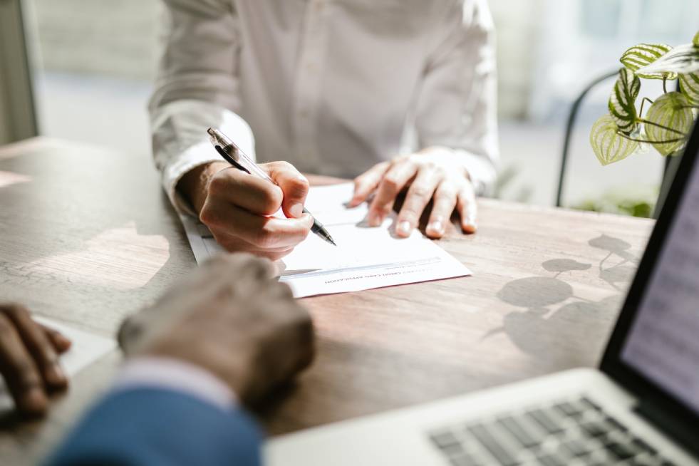 customer signing insurance papers