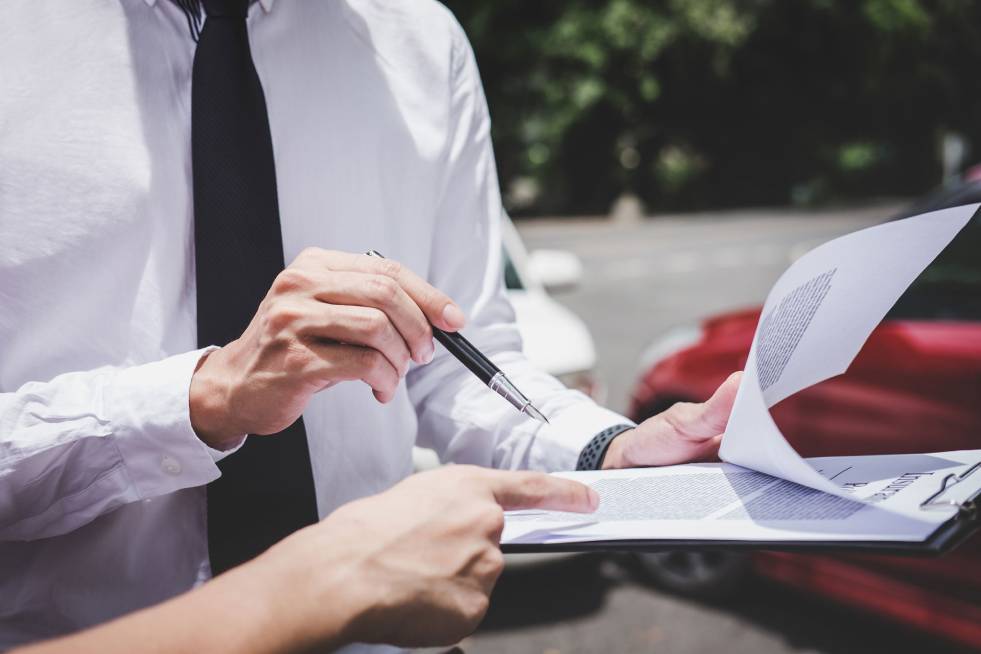 Agent showing auto insurance papers